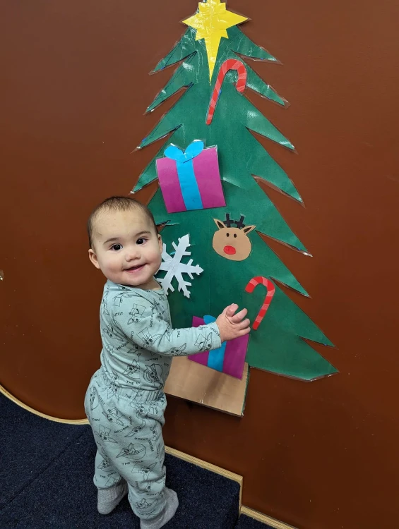 child & christmas tree