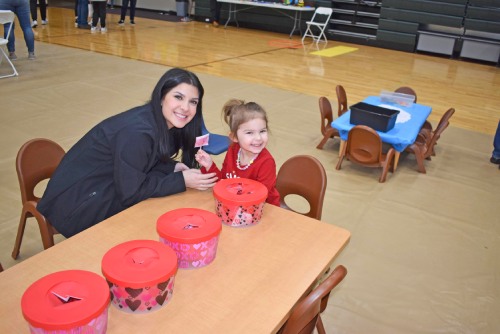 child playing with teacher