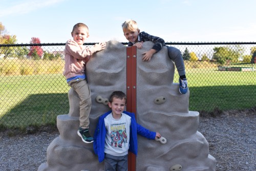 boys rock climbing outside
