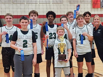 Basketball team pose with ribbons