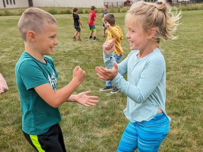 kids playing rock paper scissors